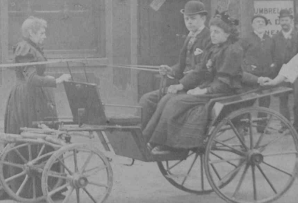 In the photo is my Great Grandmother, standing and facing her nephew (the deceased CharlesWinder's son) and her daughter (seated in the carriage), my Grandmother.